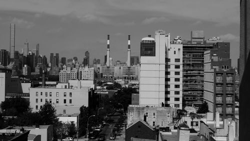 High angle view of buildings in city against sky