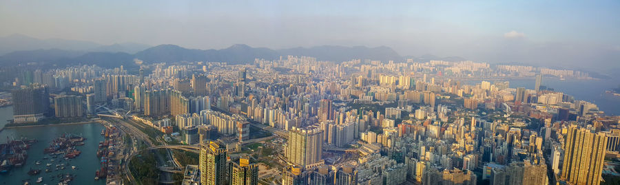 High angle view of modern buildings in city against sky