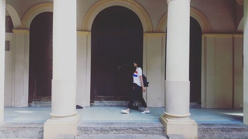 Full length of man in corridor of building