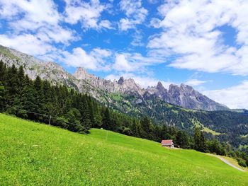 Scenic view of landscape against mountains and sky