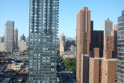 Modern buildings in city against sky