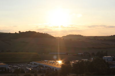 Scenic view of landscape against sky during sunset