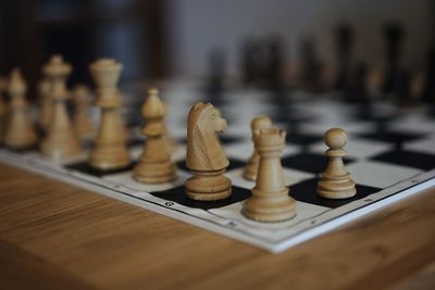 Close-up of chess board on table