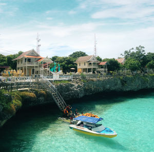 Scenic view of sea and buildings against sky