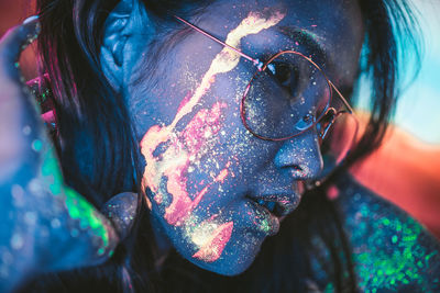 Close-up of young woman with face paint