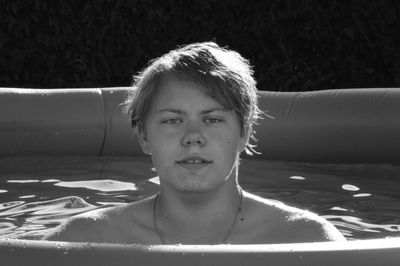 Portrait of boy in wading pool