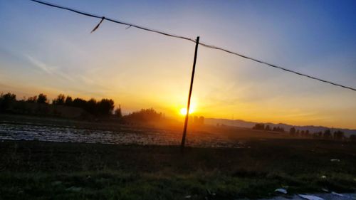 Scenic view of silhouette landscape against sky during sunset