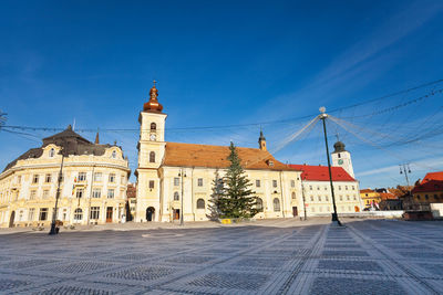 View of buildings against blue sky