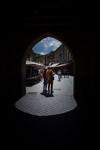 People walking in corridor of building