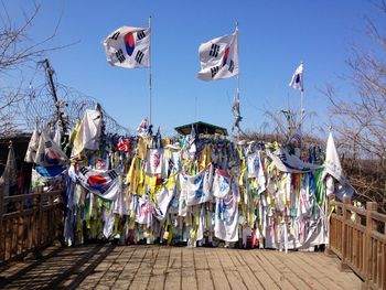 Clothes drying on clothesline against sky