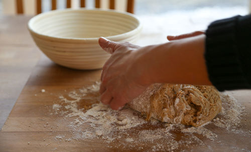 Midsection of woman preparing food on table