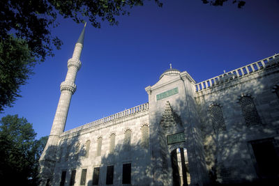 Low angle view of building against blue sky