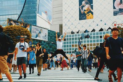 People walking on street in city