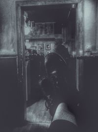 Rear view of man using mobile phone
