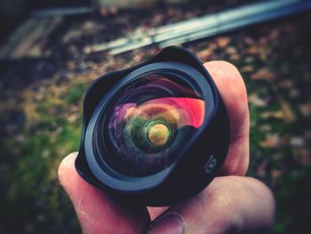 Close-up of hand holding camera