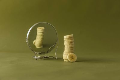 Slices of banana with reflection on mirror