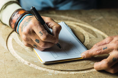 Close-up of man working on table