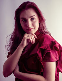 Portrait of a beautiful young woman over white background