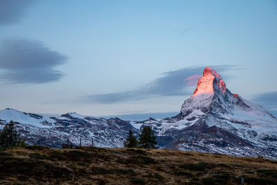 Scenic view of snowcapped mountain against sky