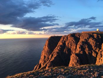 Scenic view of sea against sky at sunset