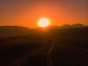 Scenic view of landscape against sky during sunset