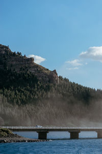 Bridge over sea against sky