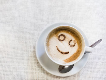 Directly above shot of coffee cup on table