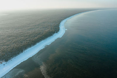 High angle view of sea shore against sky