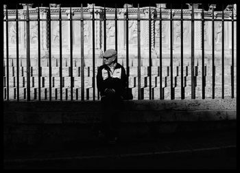 Side view of boy sitting on staircase