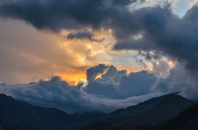 Scenic view of mountains against sky during sunset