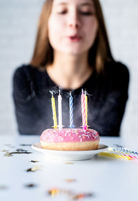 Midsection of woman with chocolate cake