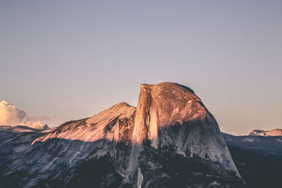 Rock formations against sky during sunset