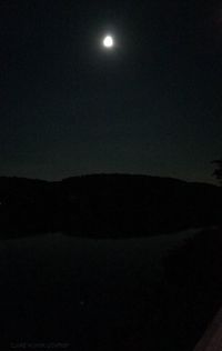 Scenic view of landscape against sky at night