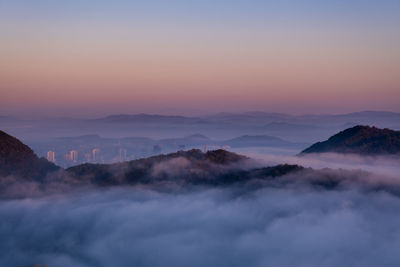 Scenic view of mountains against sky during sunset