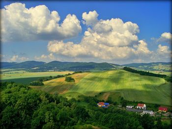 Scenic view of mountains against cloudy sky