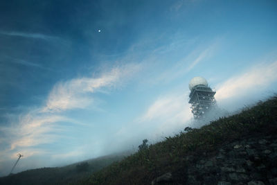 Low angle shot of water tower on landscape