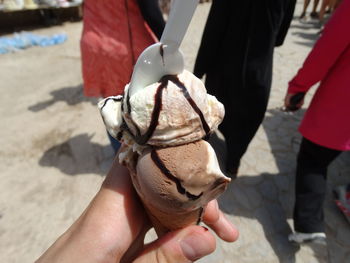 Cropped hand of person holding ice cream