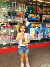 Portrait of cute girl standing outdoors