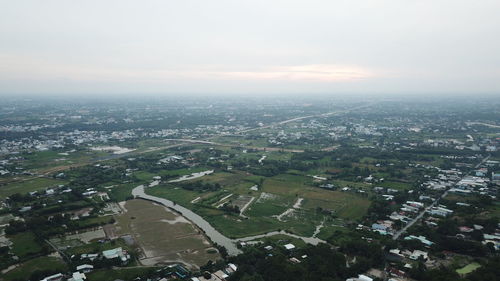 High angle view of buildings in city against sky