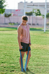 Full length of teenage girl standing on field