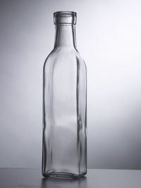 Empty bottle or container on the gray background