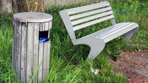 Wooden bench on grassy field