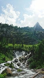 Scenic view of river flowing through rocks