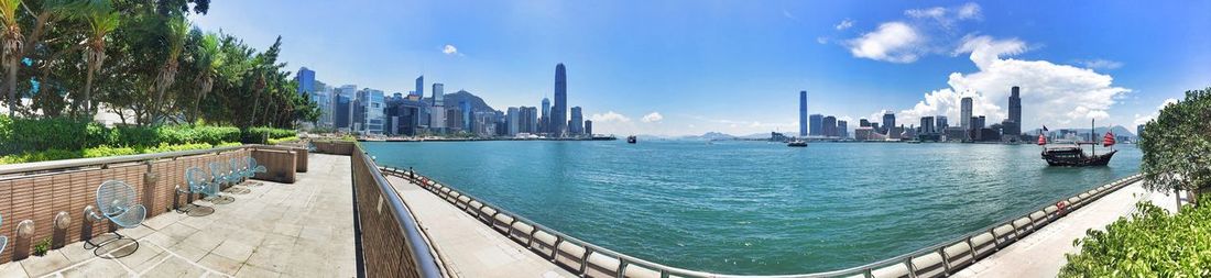 Panoramic view of sea and buildings against sky