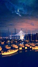 Boats moored at harbor