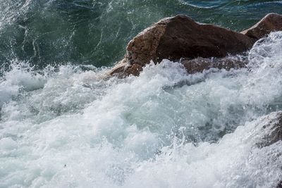 Waves splashing on rocks