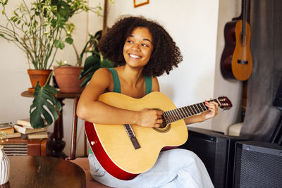 Young woman playing guitar