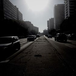 View of city street at sunset