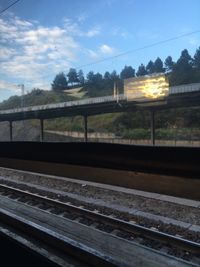 View of railroad tracks against cloudy sky