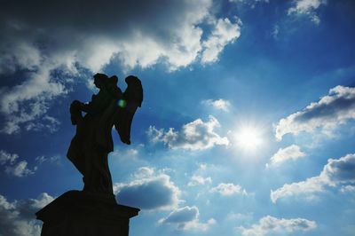 Low angle view of statue against sky